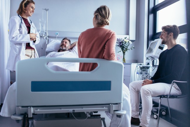 Patient on Hospital Bed Stock Image